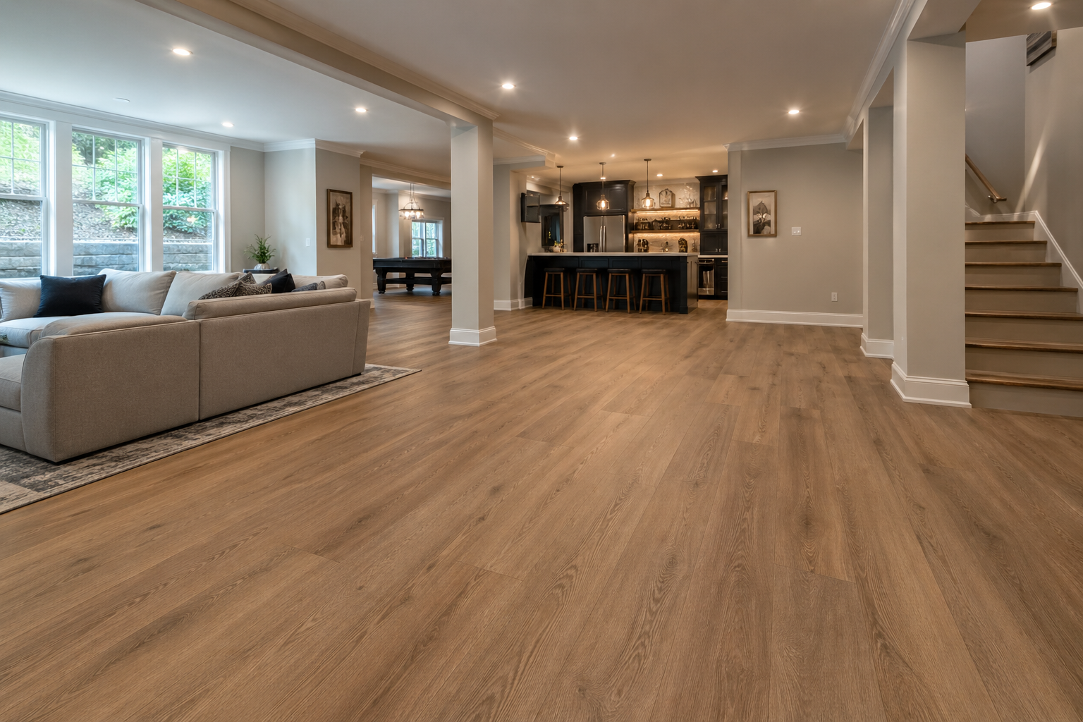 Atlanta basement flooring with wide-plank waterproof luxury vinyl plank in warm oak tone